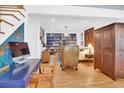 Spacious living room featuring hardwood floors, a bookcase and comfortable seating at 905 Simmons St, Mount Pleasant, SC 29464
