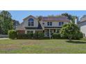 Charming two-story home with mature trees and landscaped yard at 101 N Warwick Trce, Goose Creek, SC 29445