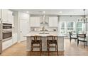 Bright, modern kitchen featuring a large island, stainless steel appliances, and a stylish dining area at 1024 Sagegrass St, Summerville, SC 29485