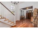 Inviting entryway showcases hardwood floors, a wood-paneled ceiling, and a wooden front door at 1153 King St, Charleston, SC 29403