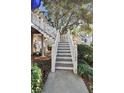 Inviting townhouse entryway with white picket fence leading to the front door, showcasing curb appeal at 1500 Trumpet Vine Ct, Mount Pleasant, SC 29466
