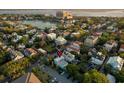 Captivating aerial view showcasing the property's location near a lake, buildings, and lush greenery at 154 Wentworth St, Charleston, SC 29401