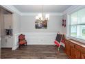 Bright dining room with decorative trim, hardwood floors, and elegant lighting at 158 Boots Branch Rd, Summerville, SC 29485