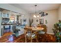 Charming dining room features hardwood floors, a pendant light, and access to the kitchen at 160 High Hammock Villas, Seabrook Island, SC 29455