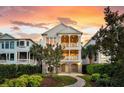 Charming home with lush landscaping and a welcoming stone pathway at 21 Morgan Place Dr, Isle of Palms, SC 29451