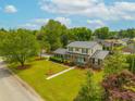 An elevated view of the home showcases its manicured lawn, lush landscaping, and proximity to the surrounding neighborhood at 310 Land O Pines Cir, Moncks Corner, SC 29461
