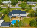 An aerial view of the backyard highlights the above-ground pool and wooden deck at 310 Land O Pines Cir, Moncks Corner, SC 29461