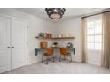 Cozy home office with a built-in desk, corner shelves, and ample natural light at 312 Tiliwa St, Summerville, SC 29486