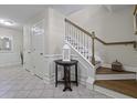 Welcoming foyer featuring a staircase, tiled floor, and neutral color palette at 4020 Conant Rd, Mount Pleasant, SC 29466