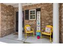 Cozy front porch with decorative brickwork, and cheerful yellow seating at 4020 Conant Rd, Mount Pleasant, SC 29466