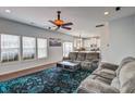 Living room with hardwood floors, ceiling fan, and a view into the kitchen at 500 Dolphin Dr, Summerville, SC 29485