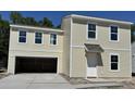 Two-story home with a two-car garage, and yard under construction at 5024 Scow Ct, Summerville, SC 29485