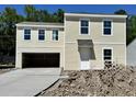 Two-story home with a two-car garage and yard under construction at 5024 Scow Ct, Summerville, SC 29485