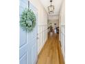 Bright foyer with hardwood floors and classic wainscoting welcomes you inside at 522 Antebellum Ln, Mount Pleasant, SC 29464