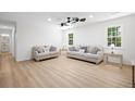 Bright and airy living room featuring neutral walls, wood-look floors, and comfortable seating at 523 Bayshore Blvd, Goose Creek, SC 29445