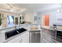 Open kitchen with stainless steel appliances, breakfast bar, and a seamless flow to the living areas at 60 Fenwick Hall Aly # 937, Johns Island, SC 29455