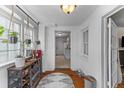 Bright hallway with hardwood floors, stylish accents, and plenty of natural light at 9 Kracke St # A & B, Charleston, SC 29403