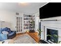 Inviting living room featuring hardwood floors, fireplace, and classic decor at 9 Kracke St # A & B, Charleston, SC 29403