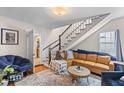 Cozy living room with hardwood floors, staircase and comfortable seating arrangement at 9 Kracke St # A & B, Charleston, SC 29403