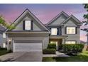 Beautiful two-story home with a manicured lawn, garage, and inviting front entrance at 9670 Pebble Creek Blvd, Summerville, SC 29485