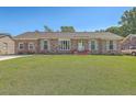 Charming one-story brick home with a neatly kept lawn and a welcoming facade at 109 Winston Way, Goose Creek, SC 29445