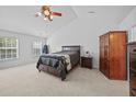 Spacious bedroom features vaulted ceiling, neutral carpet, and ample natural light from the large windows at 1218 Cosmos Rd, Summerville, SC 29483