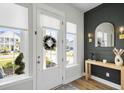 Welcoming entryway with natural light, modern accents, and a view of the neighborhood at 127 Archdale St, Summerville, SC 29486