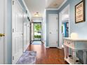 Welcoming entryway with hardwood floors, coat hooks, and a view of the bright and airy front yard at 138 Avalon Rd, Summerville, SC 29483