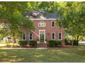 Lovely two-story brick home featuring an inviting front entrance and manicured landscaping at 1415 Inland Creek Way, Mount Pleasant, SC 29464