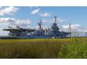 Battleship with large gun turrets and aircraft on deck at 1423 Dahlia Dr, Mount Pleasant, SC 29464