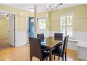 Bright dining room featuring a marble table and lots of natural light from the adjacent front door at 1516 Blaze Ln, Charleston, SC 29412