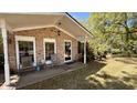 Inviting front porch with seating area, perfect for enjoying the serene outdoors and relaxation at 1521 Camp Rd, Charleston, SC 29412