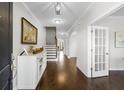 Elegant foyer with hardwood floors and ample natural light from the doorway at 1537 Fishbone Dr, Johns Island, SC 29455