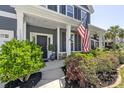 Inviting front porch with colorful landscaping, perfect for relaxing outdoors at 1537 Fishbone Dr, Johns Island, SC 29455