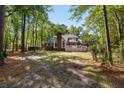 Expansive backyard featuring a brick home with a spacious deck, perfect for outdoor entertaining at 1855 Cherokee Rose Cir, Mount Pleasant, SC 29466