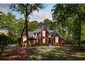 Charming brick home with manicured lawn and lush landscaping, creating a welcoming curb appeal at 1855 Cherokee Rose Cir, Mount Pleasant, SC 29466