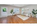 Bright living room with hardwood floors, stylish furniture, neutral colors and natural light at 2130 Weaver St, Charleston, SC 29403