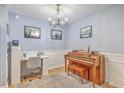 Charming office space with piano, desk, artwork and hardwood floors at 2150 Spoleto Ln # B-11, North Charleston, SC 29406