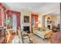 Cozy living room featuring a fireplace, plush seating, and abundant natural light at 23 Savage St, Charleston, SC 29401