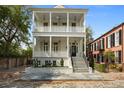 Stately two-story home with double verandas, offering a blend of classic architecture and modern living in a desirable neighborhood at 24 Chalmers St, Charleston, SC 29401