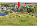 Aerial view of the community with a golf course and a waterfront view at 2640 Crooked Stick Ln, Mount Pleasant, SC 29466