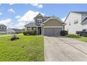 Charming two-story home showcasing a well-manicured lawn, and convenient driveway at 2911 Penobscot Dr, North Charleston, SC 29420