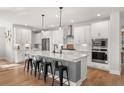 Modern kitchen with stainless steel appliances, a large island, and white cabinets at 361 Ripple Park Dr, Summerville, SC 29486