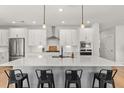 Bright kitchen with stainless steel appliances, a large island, and white cabinets at 361 Ripple Park Dr, Summerville, SC 29486