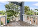 Outdoor deck with white railings offering views of the surrounding landscape and natural features at 3635 Pompano Ct, Seabrook Island, SC 29455