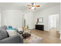 Inviting living room with wood floors, neutral paint, and a decorative area rug at 3802 Annapolis Way, Ladson, SC 29456
