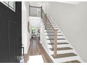 Inviting foyer with hardwood floors and a staircase with modern railings at 397 Parkdale Dr, Charleston, SC 29414