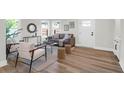 Bright living room featuring stylish furniture, hardwood floors, and natural light at 397 Parkdale Dr, Charleston, SC 29414