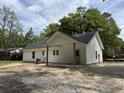 The covered back patio offers a perfect space for outdoor living, overlooking a spacious yard at 419 Ravenwood Rd, Walterboro, SC 29488