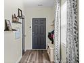Inviting entryway with wood-look flooring, storage, and plenty of natural light at 483 Pender Woods Dr, Summerville, SC 29486